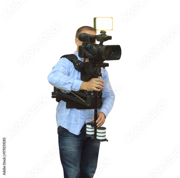 Fototapeta Video camera operator working with his professional equipment