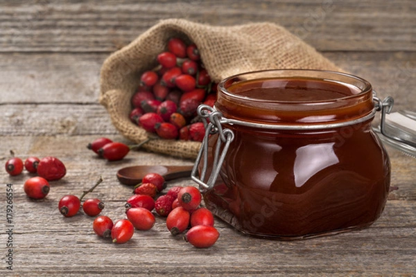 Obraz Freshly prepared homemade jam made of briar on a wooden surface