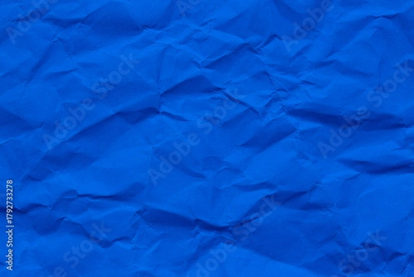 Fototapeta Macro crumpled blue paper background,Abstract light blue paper texture background. Texture of crumpled craft paper. Paper background. Recycled blue paper backdrop in close up. sky blue Textures.