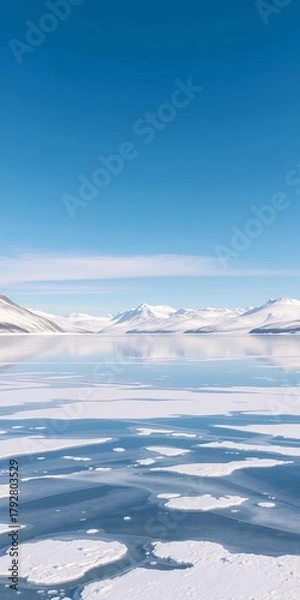 Fototapeta A frozen lake reflecting a crisp, clear winter sky with distant snow-capped mountains, tranquil and vast ,  mountains,  clear