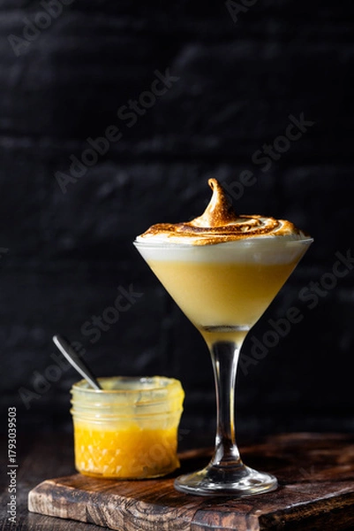 Fototapeta Lemon meringue martini with toasted meringue topping