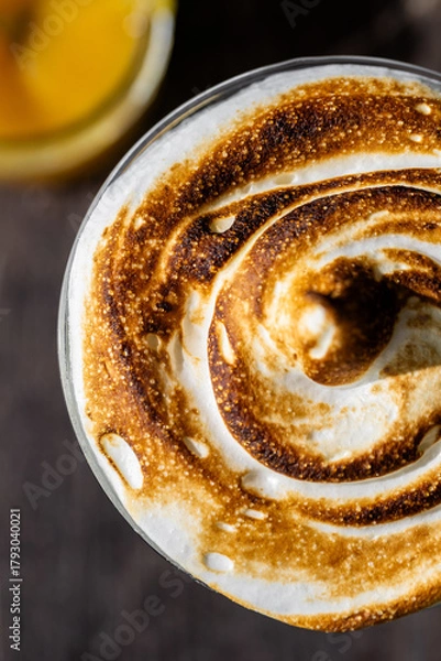 Fototapeta Lemon meringue martini with toasted meringue topping