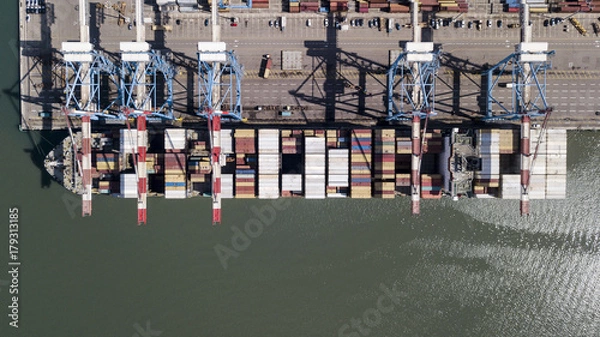 Obraz underway - LARGE container ship fully loaded with containers and cargo - aerial 4k view top down