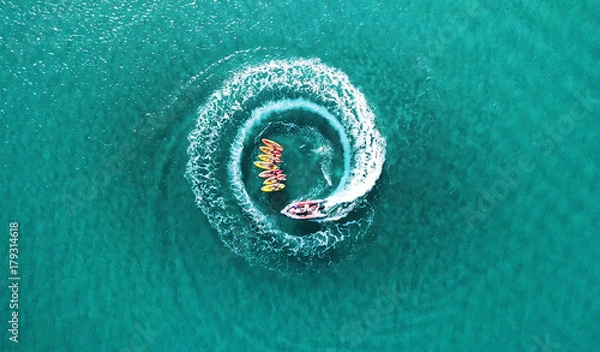 Obraz Aerial top down view os slalom made by speed boat on a Kayak sailing instruction