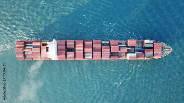 Obraz underway - LARGE container ship fully loaded with containers and cargo - aerial 4k view top down