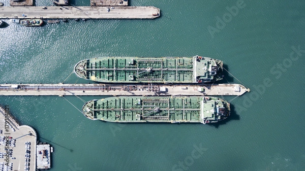 Obraz Aerial shot of two tanker ships anchored at the oil terminal at port