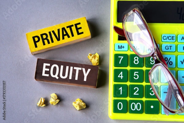 Fototapeta PRIVATE EQUITY - words on wooden blocks with calculator and glasses in the background