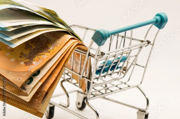Obraz Close-up Perspective of European Currency: Fanned Stack of Euro Notes (50, 20) in a Small Metal Shopping Basket.