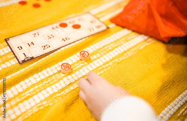 Fototapeta Happy father and child playing board game at home - happiness and family concept.