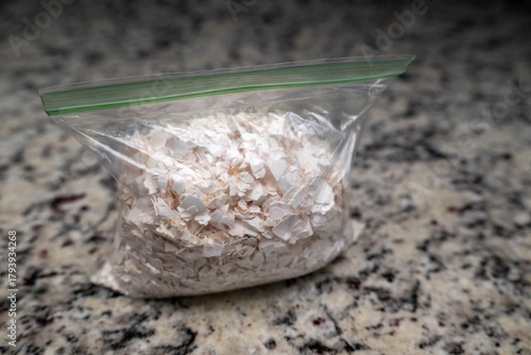 Fototapeta Crushed egg shells in a zip lock bag, great for garden, composting and adding to the garden around plants to keep slugs away