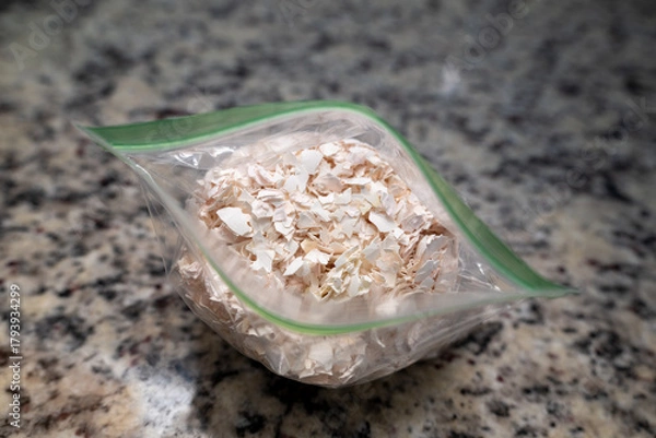 Fototapeta Crushed egg shells in a zip lock bag, great for garden, composting and adding to the garden around plants to keep slugs away
