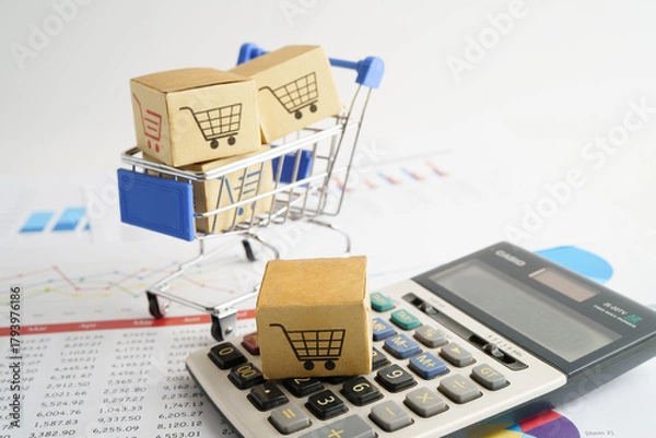 Fototapeta Online shopping, Shopping cart box on calculator, import export, finance commerce.