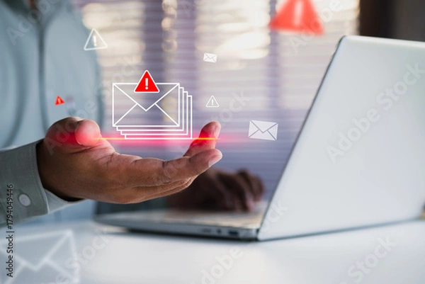 Fototapeta Email security alert concept showing a hand presenting multiple warning messages with digital threat indicators, highlighting phishing risks, cybersecurity protection for modern business communication