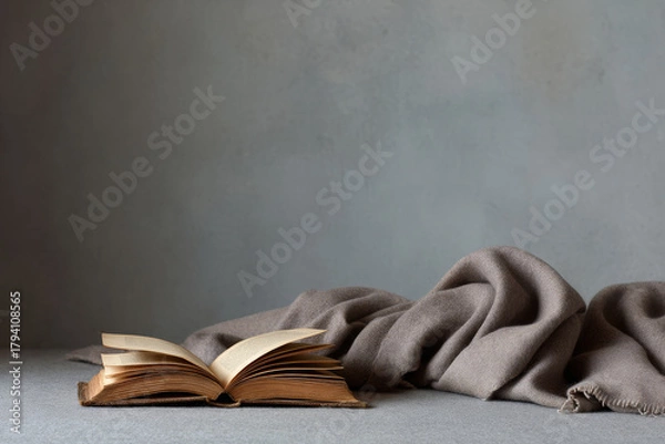 Fototapeta beautifully aged prayer book resting gently on soft woolen blanket creates minimalistic still life