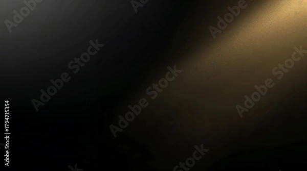 Fototapeta Golden light beam shining from the top right corner on a dark background