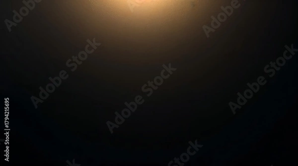 Fototapeta Dark abstract background with a subtle golden light at the top