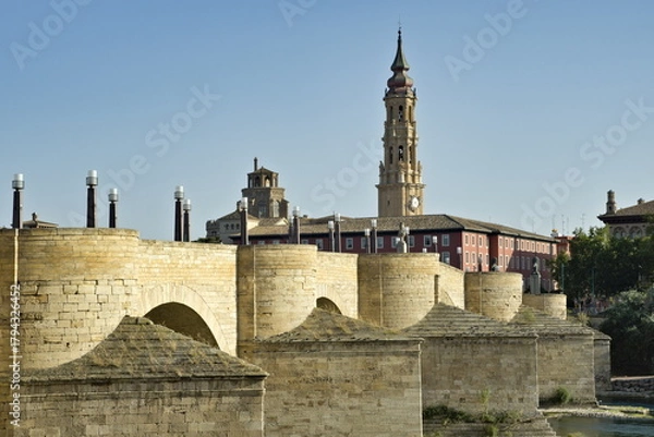 Fototapeta View of the stone bridge and the tower of the cathedral in Zaragoza, Spain