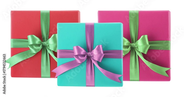 Fototapeta three brightly colored, contemporary square gift boxes wrapped in vibrant paper and tied with contrasting satin ribbons and neat bows isolated on black.