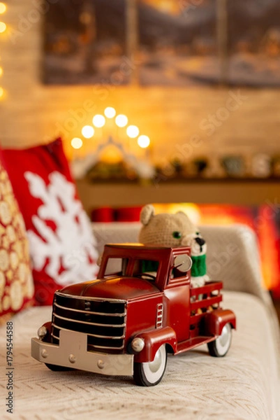 Fototapeta Cute child, blond boy, standing in front of a wooden howse, decorated for christmas, enjoying christmas atmosphere
