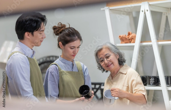 Fototapeta Mother and Family Business Owner Teaching About Material Production and Recycling