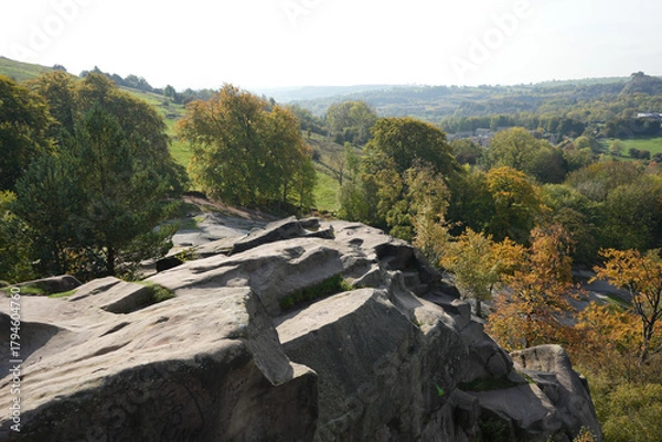 Fototapeta Scenic View From Black Rocks Showing Rugged Gritstone Formations, Vibrant Autumn Trees, And The Expansive Cromford Valley In Derbyshire, England.
