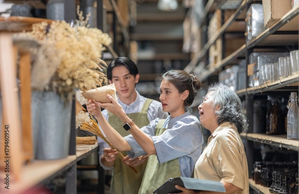 Fototapeta Mother and Family Business Owner Teaching About Material Production and Recycling