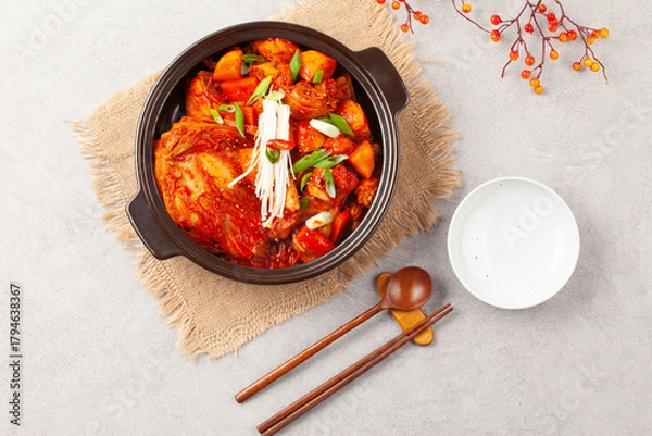 Fototapeta 닭볶음탕은 닭고기를 토막 쳐서 양념과 물을 넣고 끓인 음식. 
Dakbokkeumtang is a dish made by boiling chicken pieces with seasoning and water.
