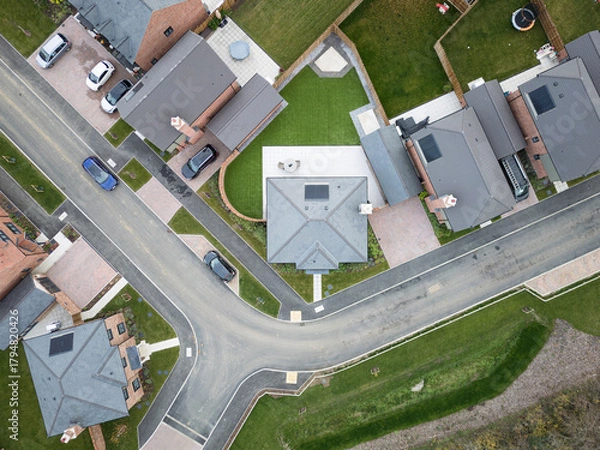 Fototapeta Drone top down view of a selection of new, luxury homes seen on a once brownfield site in rural Essex, UK. Solar panels are featured on the new homes as well as heat pumps.