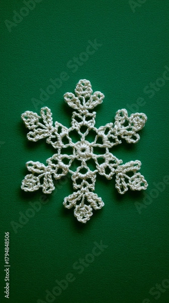 Obraz Crochet Snowflake Ornament on Green Background – Minimalist Holiday Flatlay