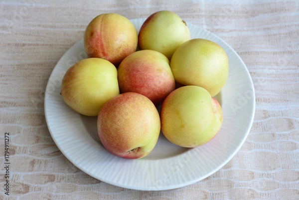Fototapeta Fresh Nectarines on a White Plate cut out