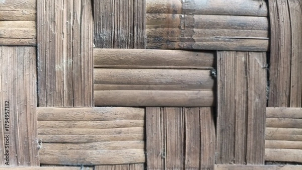Fototapeta Traditional bamboo weave texture with geometric pattern and natural brown tones,