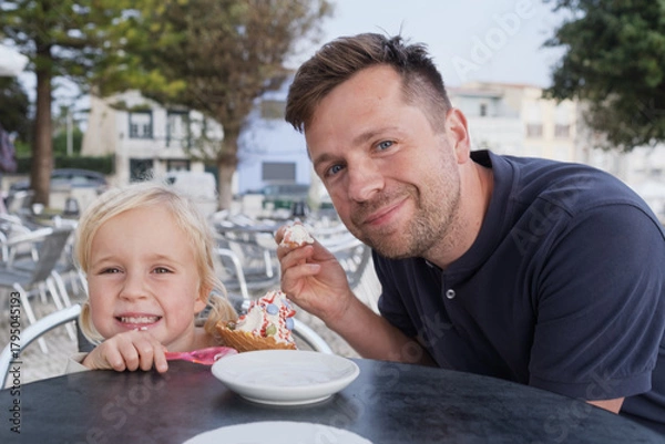 Obraz Girl Eating Ice Cream with Her Dad at a Cafe