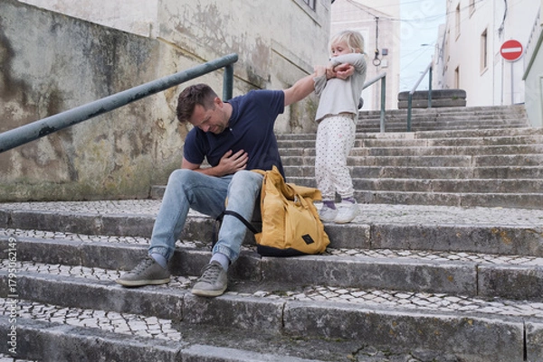 Fototapeta A Father Having a Health Problem and His Little Daughter Trying to Help