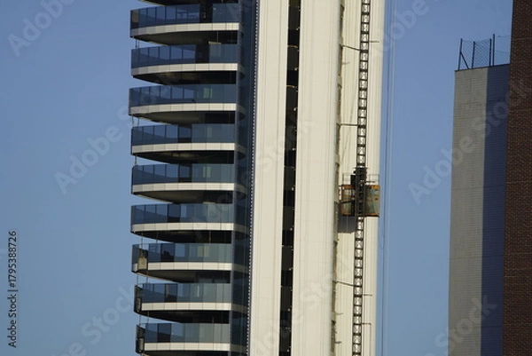Fototapeta Construction elevator on a new building in Fortaleza Ceará, Brazil.
