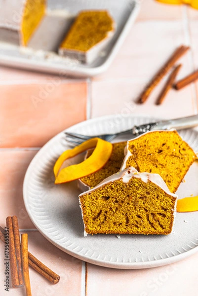 Fototapeta Pumpkin spice cake with fresh pumpkin and sugar frosting
