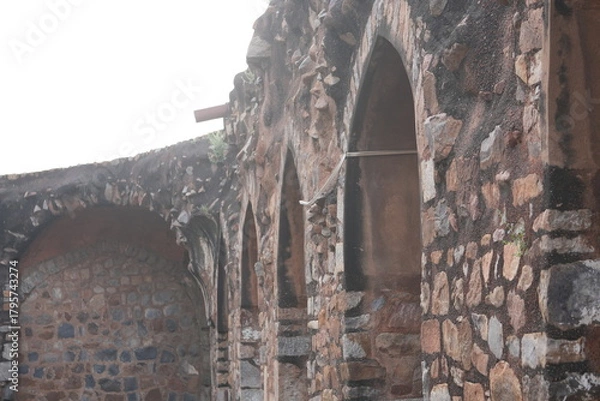 Fototapeta Stone Archway and Weathered Wall of Ancient Indian Fort