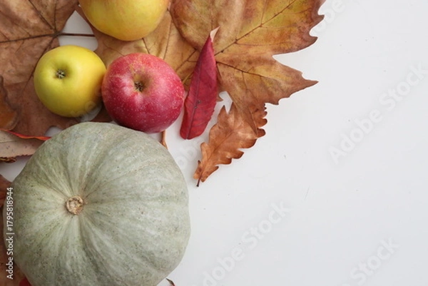 Obraz Pumpkin and apples laying  on white table