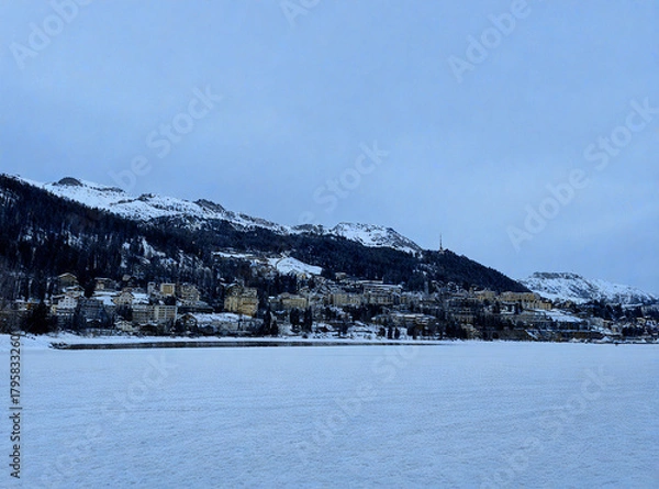 Obraz Alpine Village by a Frozen Lake in Winter