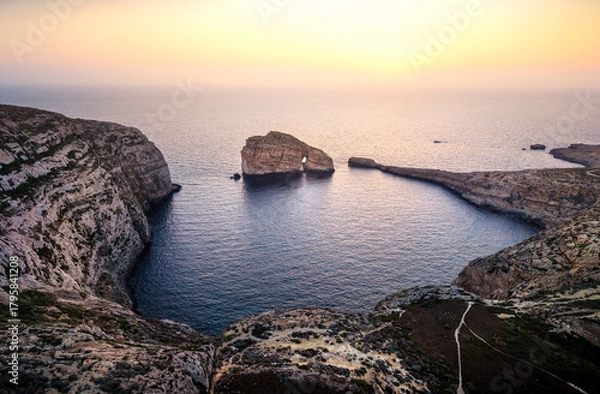Obraz Scenic sunset view over the coastline of Gozo Malta highlighting majestic cliffs and calm waters