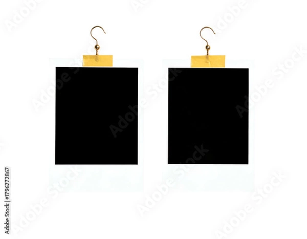 Fototapeta Two empty photo frames hang by hooks