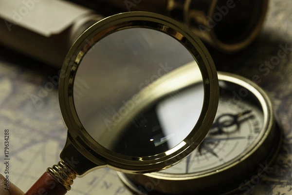 Fototapeta Retro compass with old map and spyglass