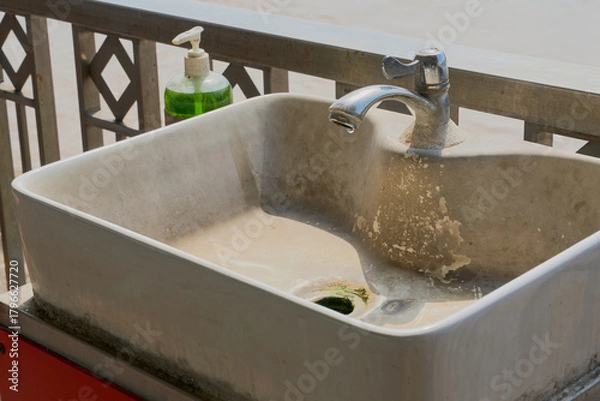 Fototapeta The old sink has scale buildup.