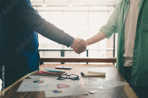 Obraz Two hipster shaking hands on meeting