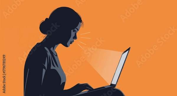 Fototapeta Silhouette of a woman intensely focused on her laptop screen.