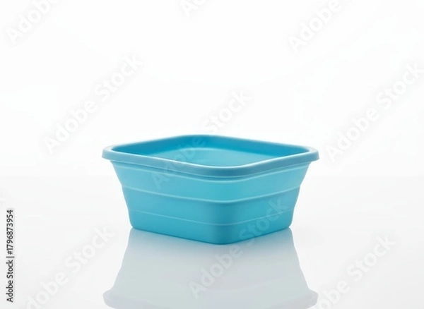 Fototapeta Blue silicone foldable food container on clean white background