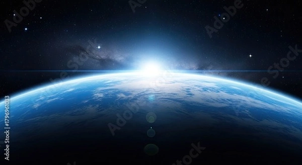 Fototapeta A breathtaking view of earth from space, showcasing the planets vibrant blue oceans, swirling clouds, and the radiant glow of the rising sun
