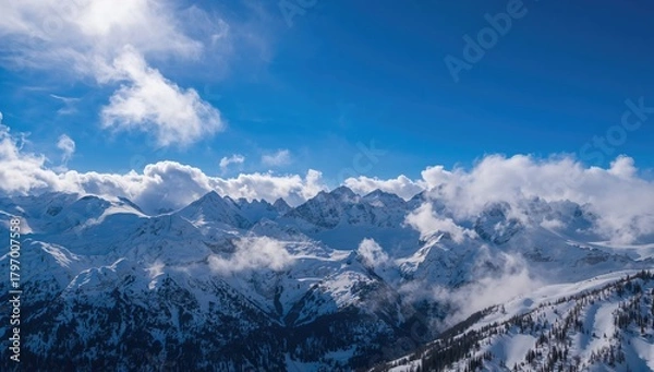Obraz Vertical view of snow-laden mountains beneath a vibrant blue sky, seasonal change