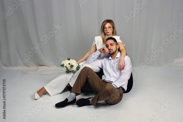 Fototapeta A wedding portrait of the newlyweds. Portrait of a guy and a girl in love