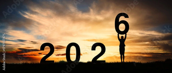 Fototapeta Silhouette of a strong business woman standing at dawn already active and motivated, greeting card for the new year 2026.
