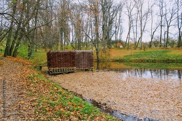 Obraz A bath woven from a willow twig on the estate of Leo Tolstoy in Yasnaya Polyana and a small pond.